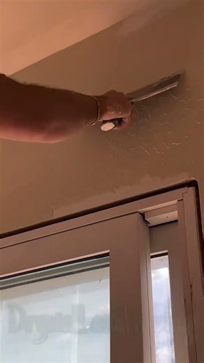 Smoothing plaster on wall corners for sharp clean finish