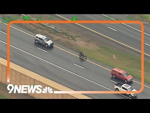 Aerial video shows motorcycle driver speeding, weaving through traffic