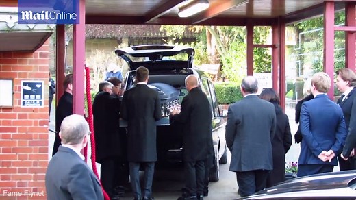 Guests arrive to pay respects at Rick Parfitt's funeral in Woking