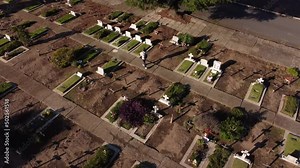 Woman in sorrow, walking through the cemetery and remembering her loved ones. Aerial. Stock Video