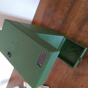 Unnecessarily complicated hand sanitizer dispenser