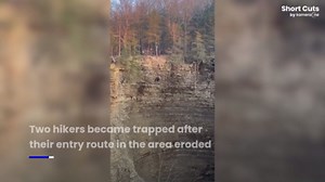 Rescuers rappel 200 feet down sheer cliff to save hikers in New York
