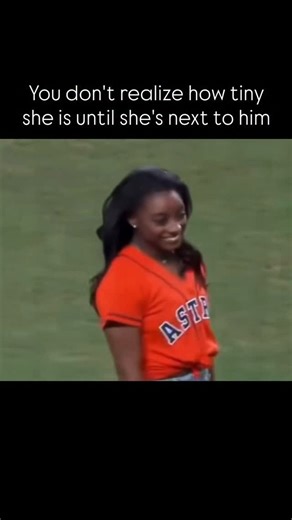 @sports.lifee_ on Instagram: "The post shares a video clip of Olympic gymnast Simone Biles, standing at 4 ft 8 in (142 cm), beside her husband Jonathan Owens, a 5 ft 11 in (180 cm) NFL safety, during a stadium appearance, underscoring their striking 15-inch height disparity. Rainmaker1973, known for curating awe-inspiring visuals, uses the footage to playfully highlight Biles’ petite build, a trait advantageous in gymnastics for leverage and power-to-weight ratio, as supported by biomechanical s