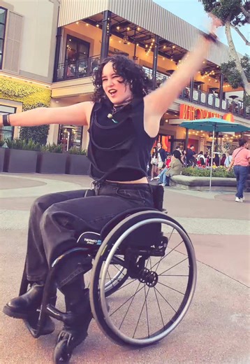 obsessed with this dance so much it’s so fun hehe yay happy 2016! [alt text: charlie is a young androgynous person with short curly hair, a black tank top with a ripped top over it, and black jeans, sat in their black wheelchair. they start close to the camera, smiling then back up and dance the popular “lush life” trend.] #disableddancer #disabledcreator #wheelchair #wheelchairuser #disabledtiktok