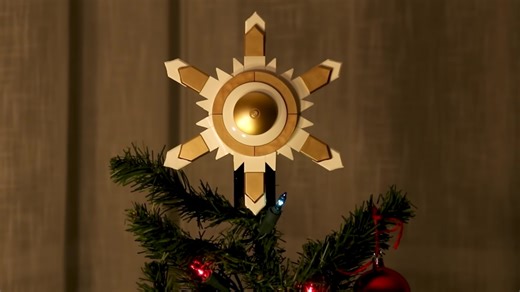 This LEGO Christmas Tree Topper 'Twinkles' Beautifully