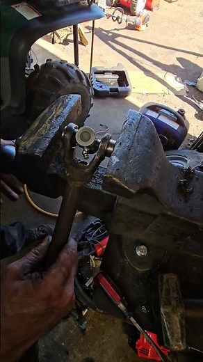 how to install a drive shaft u joint on a Polaris four-wheeler.