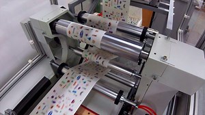 Premium stock video - Print and cut feature synchronized machine producing stickers