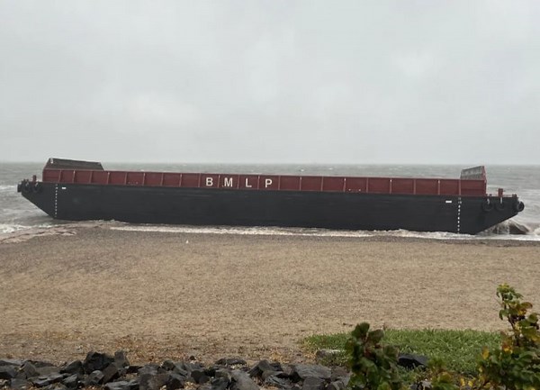 Barges that washed up in Milford drift to West Haven