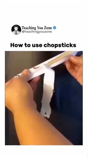 Teaching You Zone on Instagram: "Using chopsticks starts with learning how to position them correctly in your hand. Hold the first chopstick like a pencil would rest, placing it between your thumb and the base of your ring finger so it stays mostly still. Lay the second chopstick on top, gripping it lightly with your thumb, index finger, and middle finger. This top stick is the one that moves. Practice opening and closing the gap by moving only the upper chopstick while keeping the lower one ste