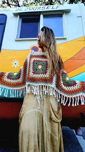 ​"Soft, stylish, bohemian crochet poncho is the perfect layer for festival vibes."