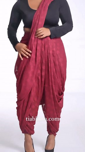 9.2K views · 86 reactions | Dhoti draping 101. Can you tell it’s one of our favourite drapes? Outfit Details: ✨Cherry Polka Dot Saree ✨Black Leeanna Blouse ✨Pinot Noir Silhouette Pants ✨Athena Gold Waist Chain [dhoti, saree, saree drape, saree draping tutorial, how to drape a saree, saree draping styles, south Asian fashion, saree fashion, tia bhuva, saree trends, sari] | TiaBhuva.com | Facebook