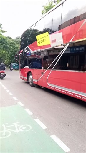 Two buses from different companies heading to the same city Malang East Java