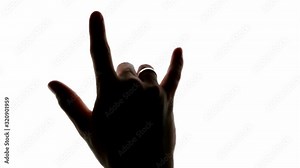 Rock and roll music devil horns hand sign on a chroma key white screen Stock Video