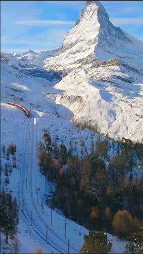 "Epic Train Ride Through the Swiss Alps to the Majestic Matterhorn!"