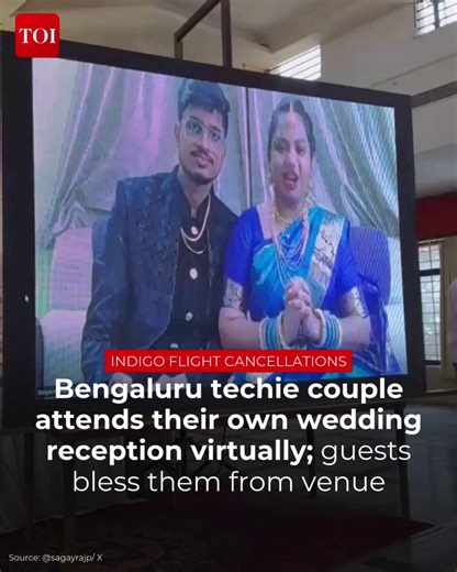 A newlywed couple were forced to attend their own wedding reception virtually after nationwide flight disruptions left them stranded in #Bhubaneswar, over a thousand kilometres from their venue in #Hubballi. With guests already arriving and the venue decorated, the couple appeared on a large screen at the reception hall through a video call. More details 🔗http://toi.in/DzppNa #IndiGo #DelhiAirport #IGIAirport #FlightDelays #Cancellations | The Times of India