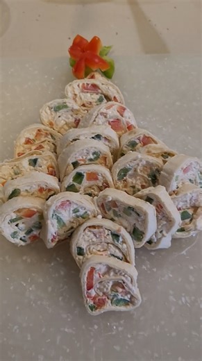 Collin Morgan on Instagram: "Easy Christmas Pinwheels 🎄✨ Creamy, festive, and perfect for holiday parties! Ingredients: - 8 oz cream cheese, softened - 4 oz sour cream (or enough to make spreadable) - Taco seasoning, to taste - 3–4 tortillas (can use low carb) - Chopped red & green peppers Directions: Mix cream cheese, sour cream, and taco seasoning until smooth. Stir in peppers. Spread evenly over tortillas, roll tightly, slice into pinwheels, and serve! Tip: Make up to 1 day ahead—any longer 