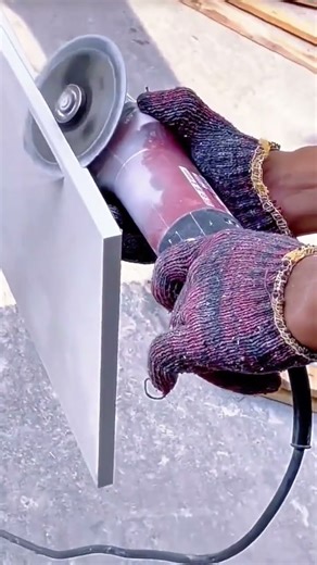 Grinding Ceramic Tiles Manually Using Hand Sanders for Professional Home Construction