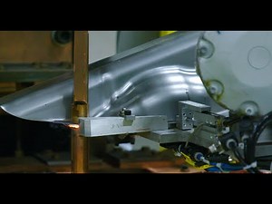 Robot Assisted Fuel Tank Projection Welding System