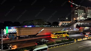Time-lapse of speeding cars and bus on a busy city highway at night, 4K, 60 fps