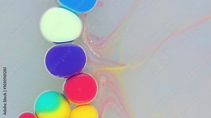 Colorful liquid art creation with vibrant swirling patterns and captivating movement in a clear container