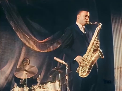 Art Blakey & The Jazz Messengers - Blues March (Live) (1958) "Blues March" by Art Blakey & The Jazz Messengers, from the 1958 album "Moanin’," blends blues rhythms with military march cadences. Composed by saxophonist Benny Golson, the track captures the essence of the hard bop era. Blakey's drumming, with a march-like pattern, sets the stage for the interplay between horns. Golson’s composition merges genres, with blues elements offering a soulful counterpoint to the march rhythm. The brass sec