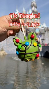 There are three specialty candy apples at the Disneyland Resort right now. They came out a little early and can be found at all candy stores resort wide. $13.99 each (Magic Key Discounts Available) Mickey Christmas Lights Apple: Green apple dipped in caramel with two marshmallows ears enrobed in green, white chocolate and decorated with black dark chocolate and M&M’S chocolate candies lights Minnie Santa Hat Apple: Green apple dipped in caramel with two marshmallows ears enrobed in milk chocolat
