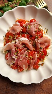Cool, creamy burrata meets warm burst cherry tomatoes and salty prosciutto… this might just be the most irresistible appetizer. 🍅 Ready in minutes, full of flavor, and perfect with crusty bread. Save this burrata with tomatoes and prosciutto recipe - you’ll want to make it on repeat! Recipe is in the first comment ⬇️ | katerynascafe