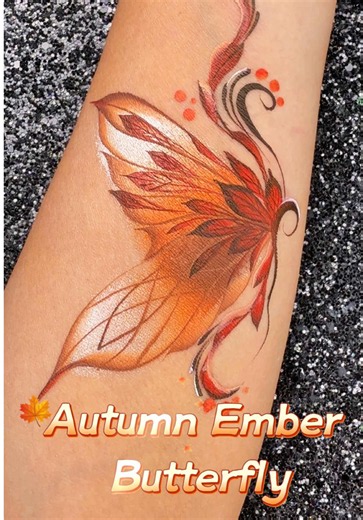 Autumn Butterfly Face Painting — Fiery Orange & Red Design