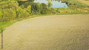 Aerial flying above stunning beautiful rural Europe landscape autumn with fields, forests, lakes. Wonderful drone video for ecological concept.