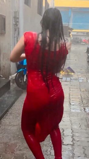 Stunning Red Dress Dancing in a Rainy Alley