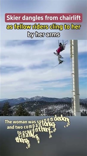 【Skier dangles from chairlift as fellow riders cling to her by her arms】