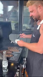 Behind the scenes: He calls it ‘steak basting’ — I call it a full-contact sport. 🔥🥩🍺 Bonus points for grilling with one hand and guarding the Corona like it’s a newborn. | JoCooks