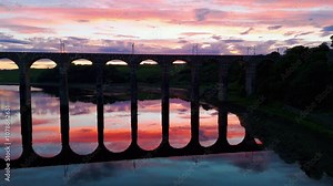 Berwick, Northumberland, UK, June 19, 2024; sunset rise up reveal aerial clip of the Royal Border Bridge Viaduct, Berwick, Berwick-upon-Tweed, Northumberland, England, UK.