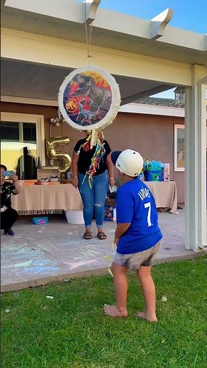 Zeke pulls string piñata
