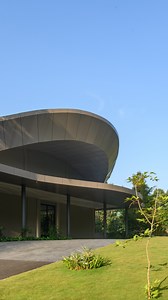 The Base Eleven Convention Centre in Pala, Kottayam, stands as a modern architectural landmark, thoughtfully designed to elevate event experiences. Spanning 75,000 square feet, the venue seamlessly blends contemporary design with traditional influences, offering a versatile space for corporate meetings, cultural programs, and grand celebrations. The architecture is defined by its flowing, curved forms and intricate parametric elements, creating a striking visual presence. A well-planned central 