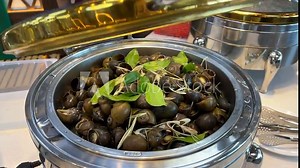 boiled shells Cooking clams in a pan at home. Close-up of clams simmering in white wine.