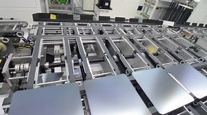 Photovoltaics production process solar panel assembly line operated by high tech robot arms in modern sustainable factory | Premium Stock Video Footage