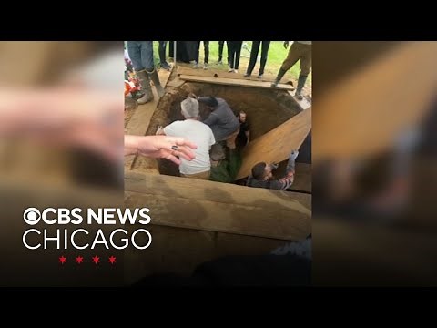 Pallbearers fall into open grave during Philadelphia funeral