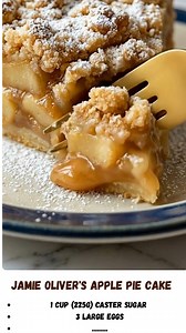 Jamie Oliver's Apple Pie Cake: A rustic, comforting classic that sits perfectly between a fluffy sponge cake and a fruit-filled pie! 🍏🍰 This "Dorset Apple Cake" style dessert features a buttery, lemon-zested batter packed with chunks of tender, sweet apples. It bakes up golden and crisp on the outside, while staying incredibly moist and soft on the inside. Dusted with powdered sugar, it's the ultimate tea-time treat. #ApplePieCake #JamieOliverRecipe #DorsetAppleCake #AppleCake #FallBaking #Rus