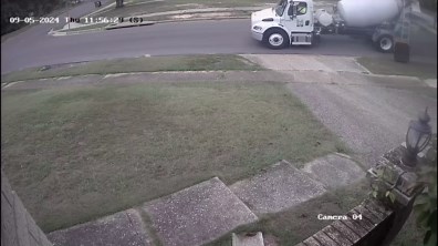 Man Shocked to See City Worker Rinsing Cement Chute Into Drain Outside His House