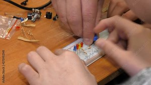 Children learn to assemble a simple electrical circuit. Electronics for children. We collect simple schemes, experimenting with electricity.