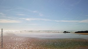 Sweeping pan shot of Mawgan Porth Beach, Cornwall, England