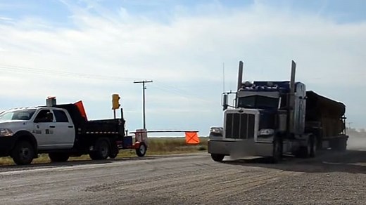 Semi-trailer blasts past flagger machine
