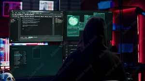 Experienced hacker writing lines of code on computer from underground bunker, tying to get past security systems. Rogue programmer building scripts that can hack devices, camera A Stock Video