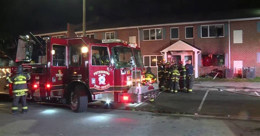 Apartment fire displaces nearly two dozen people, woman jumps from second-story window to escape