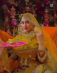 Sakina Aleem, glowing in Khuda Baksh by Rashid Sidhu's outfit, brings timeless artistry to life at a mehndi function. | KHUDA BAKSH