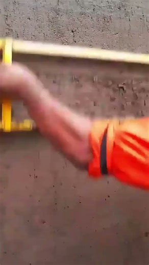 the process of leveling cement mixture on the walls outside a building using simple tools #popular