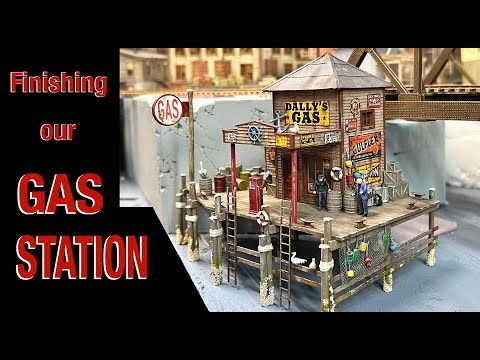 Finishing our gas station on a pier for our model railroad layout!