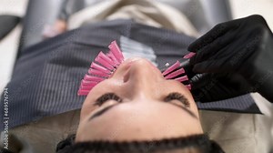 Thread lifting is a cosmetic facial rejuvenation procedure. A cosmetologist implants cosmetic threads under the skin for face lifting and rejuvenation in a modern clinic. Stock Video