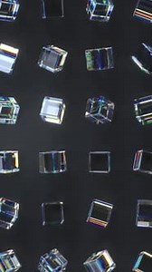 Vertical Animation of Rotating Prismatic Glass Cubes